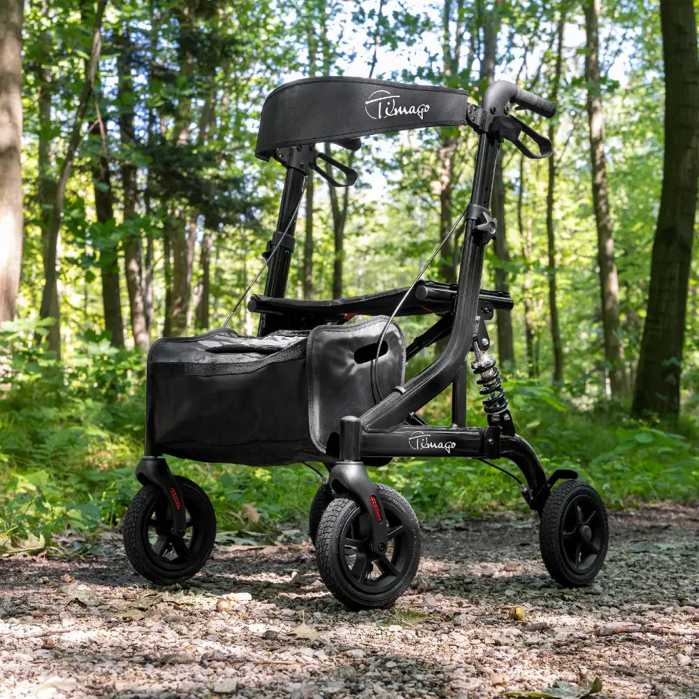 Timago JOHNNIE 4-hjulet letvægtsrollator i sort aluminium med sæde og indkøbstaske